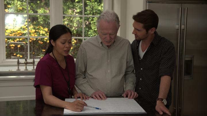 Home Health Aide with Patient and Family Member