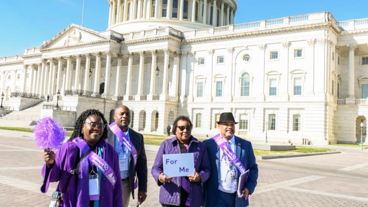 black advocates walking from capitol