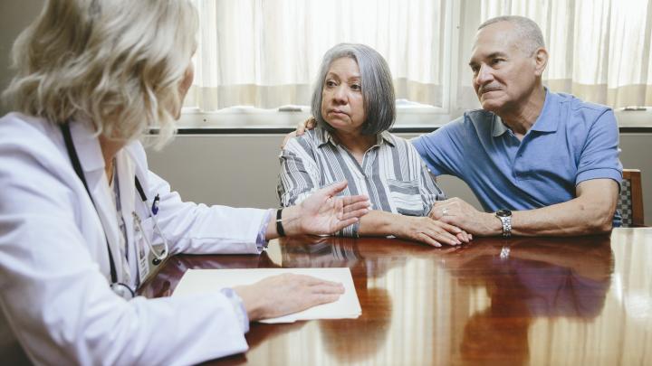 Doctor with senior couple