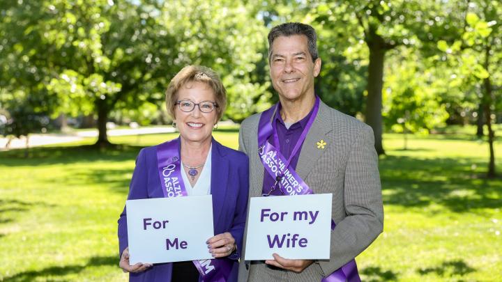 Couple with signs