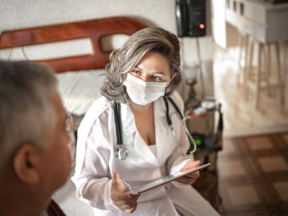 Masked doctor with patient