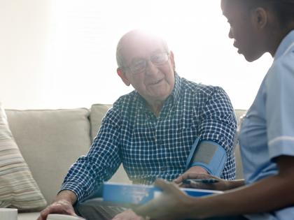 An image of a nurse taking a patient's blood pressure